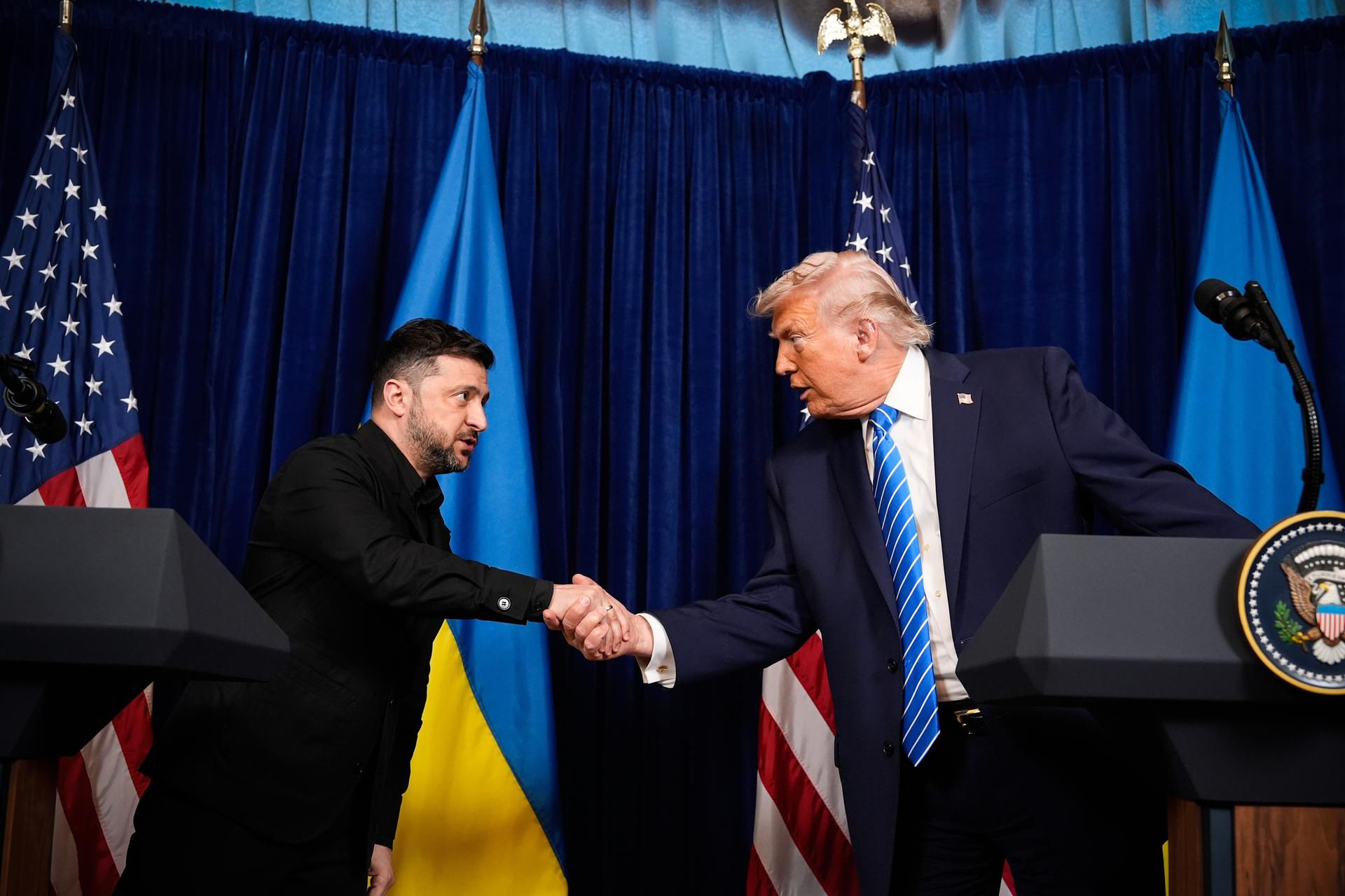 President Donald Trump and Ukraine's President Volodymyr Zelenskyy shake hands at the start of a joint news conference following a meeting at Trump's Mar-a-Lago club, Sunday, in Palm Beach, Fla.