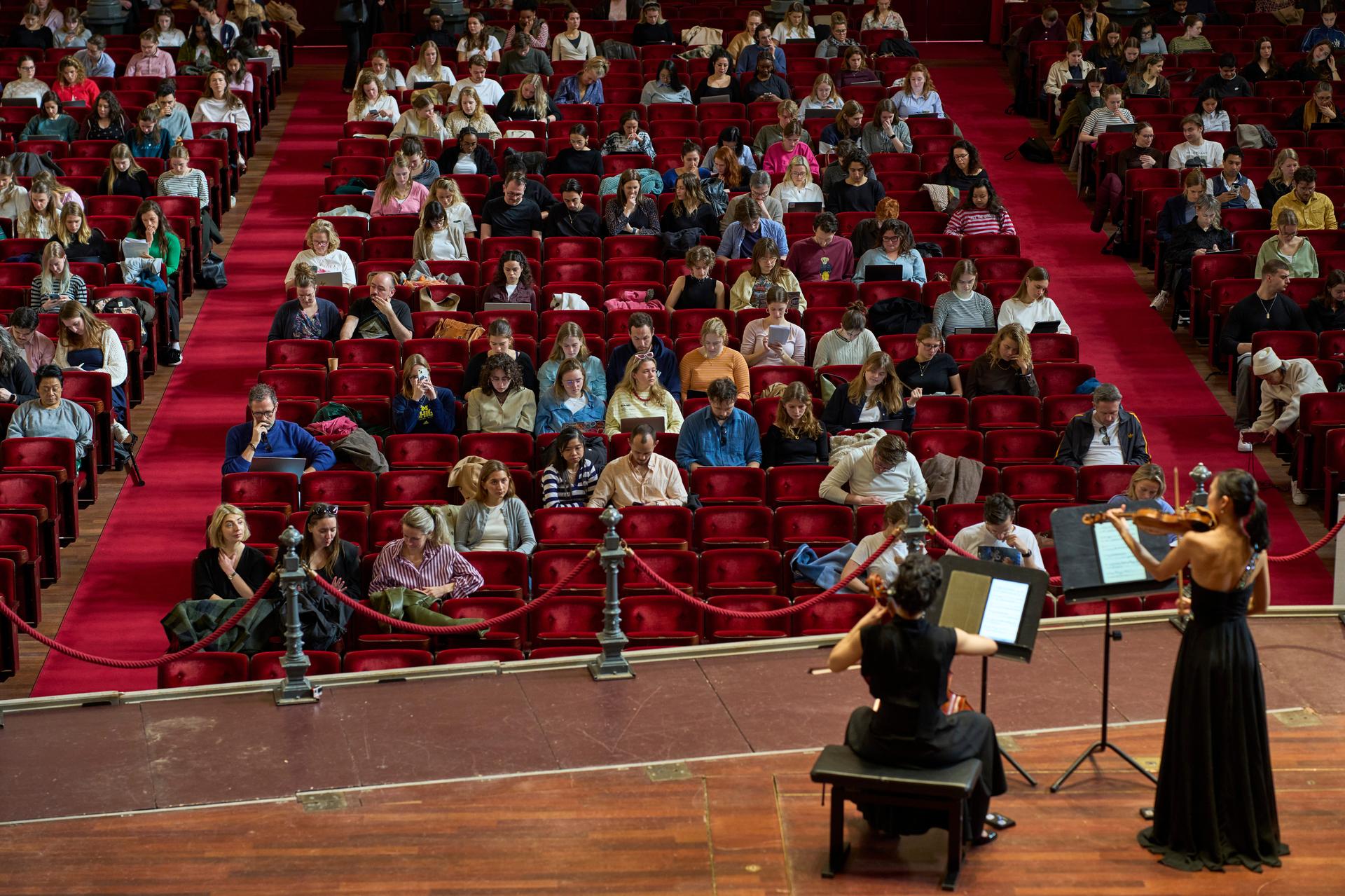 Violinist Hyunjin Cho and cellist Efstratia Chaloulakou perform for students studying with music at Concertgebouw in Amsterdam, Netherlands, on March 5.