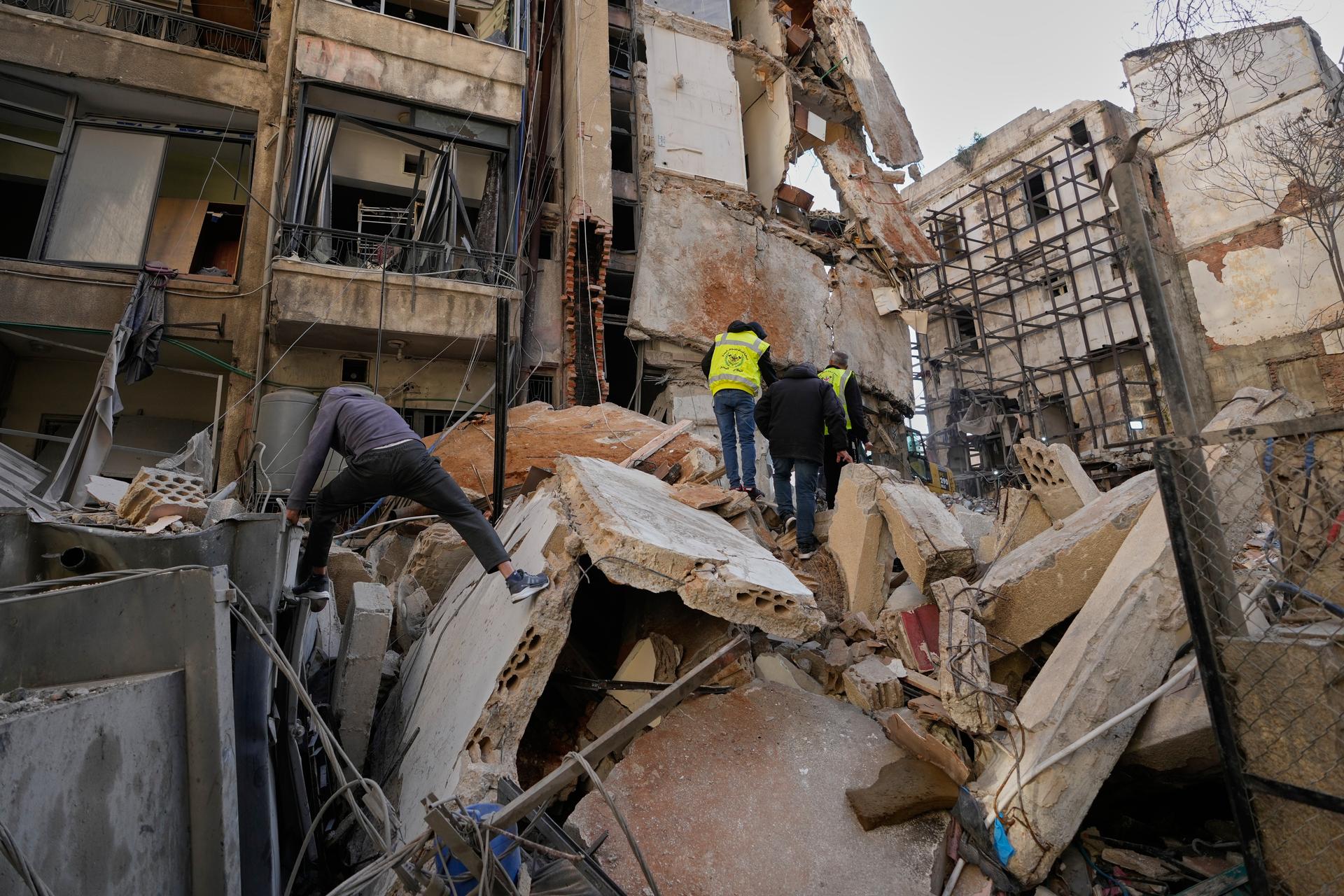 People inspect the rubble of a building destroyed in an Israeli airstrike a day earlier in Beirut, Lebanon on Thursday.