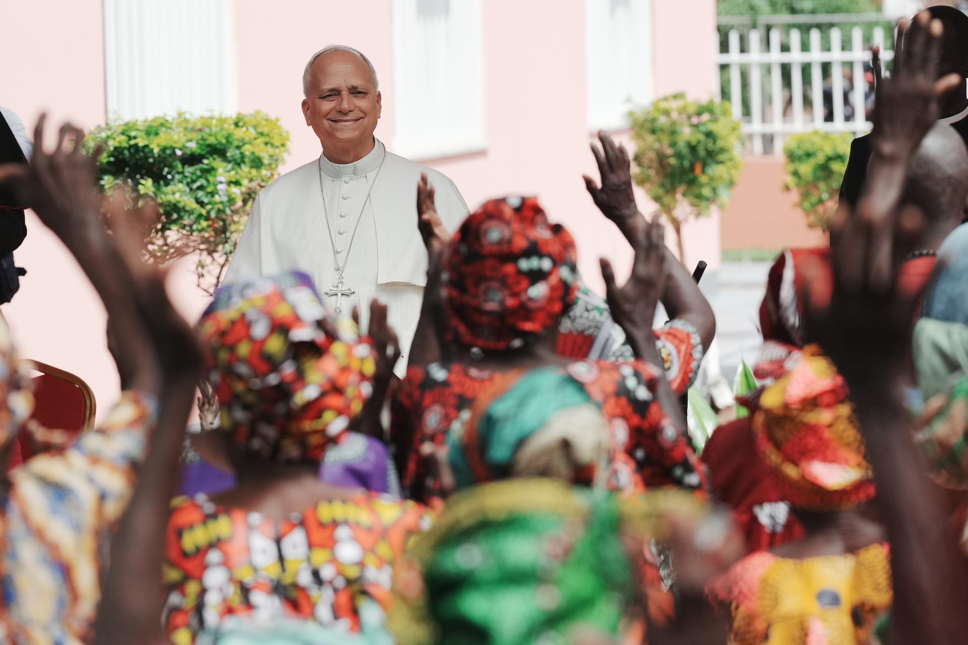 Pope Leo XIV is cheered by faithful during a visit to a nursing home in Saurimo, Angola, on Monday. (AP Photo/Andrew Medichini)