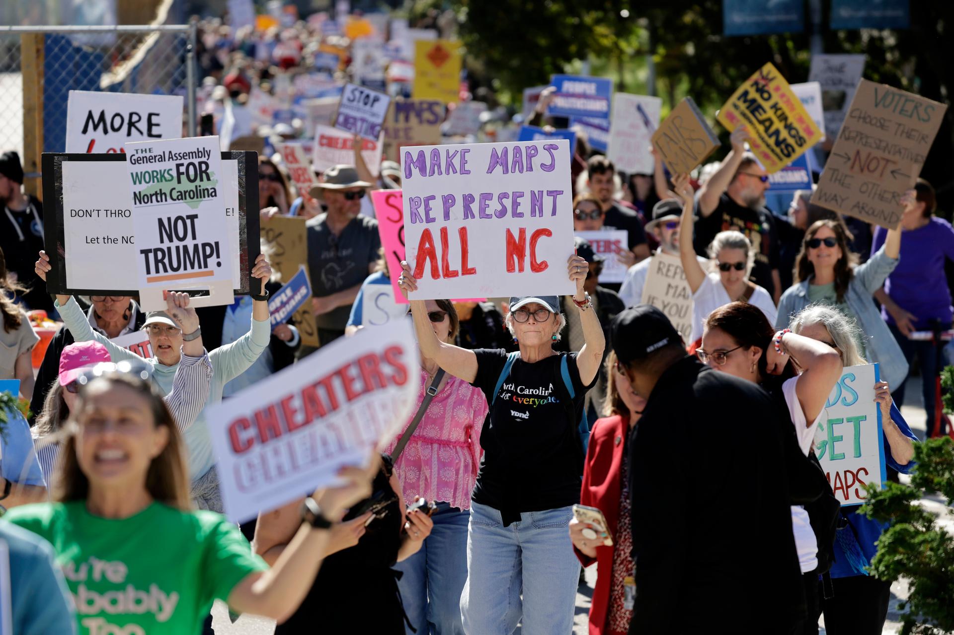 Marchers proceed from the Capitol during a rally protesting a proposed redistricting map Tuesday in Raleigh, N.C. (AP Photo/Chris Seward)