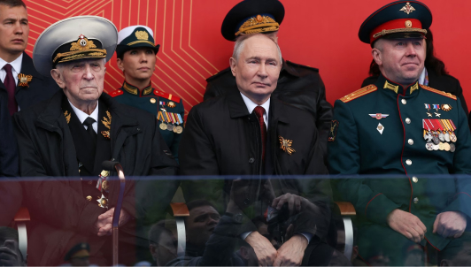 Photograph of Vladimir Putin surrounded by decorated military leaders