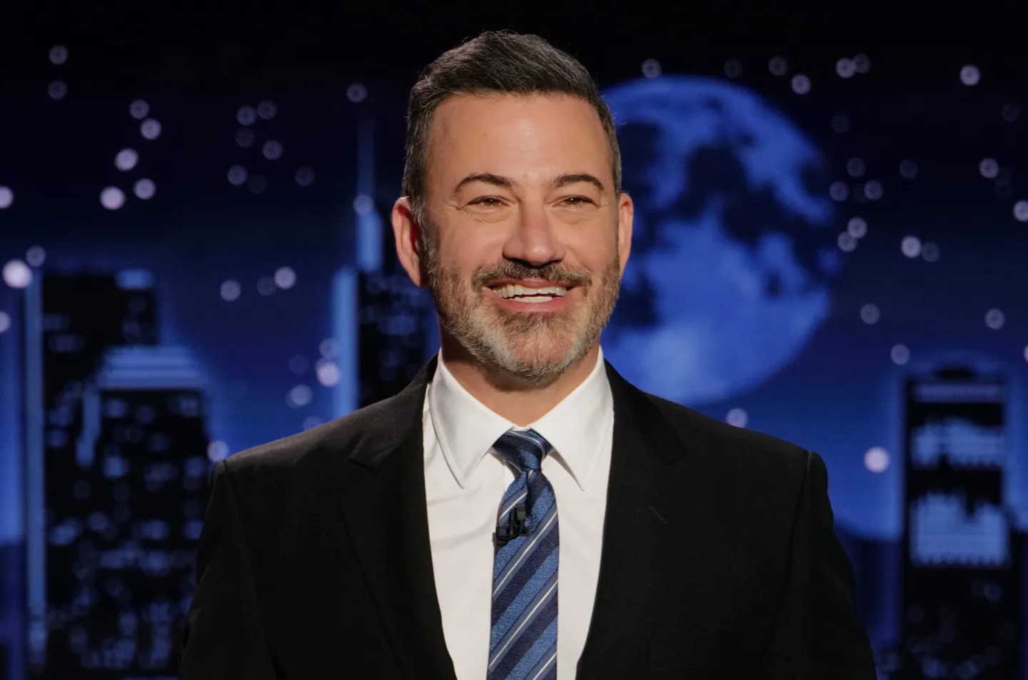 a smiling man in a suit