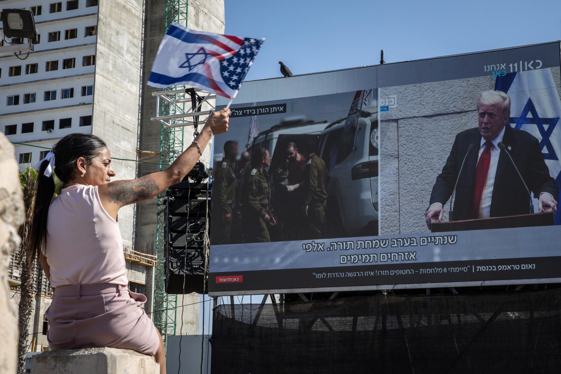 In this photo illustration, the Sora app icon is seen inside an AI folder on a smartphone screen in front of the OpenAI logo.