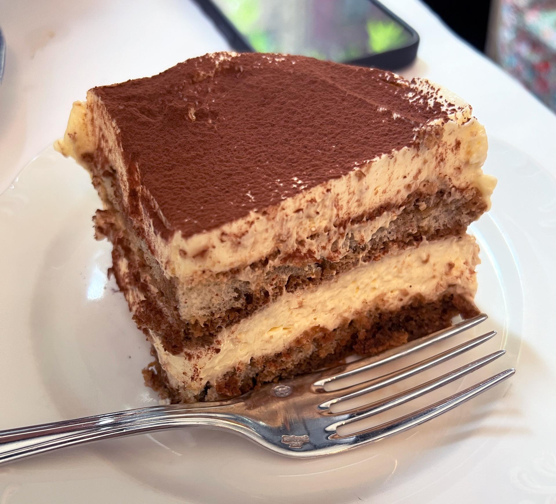 A tiramisu on a plate.