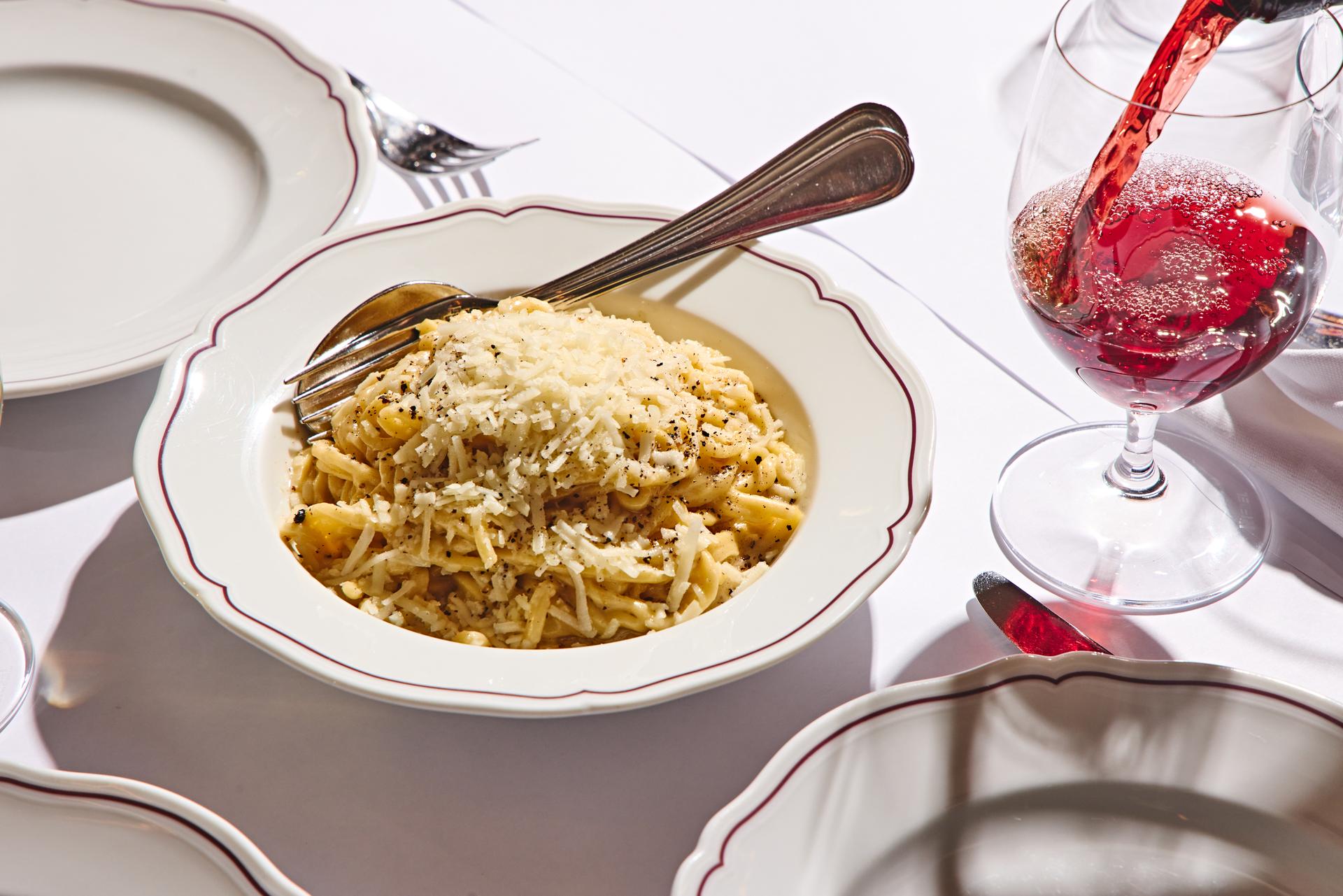 A plate of saucy cheesy pasta.