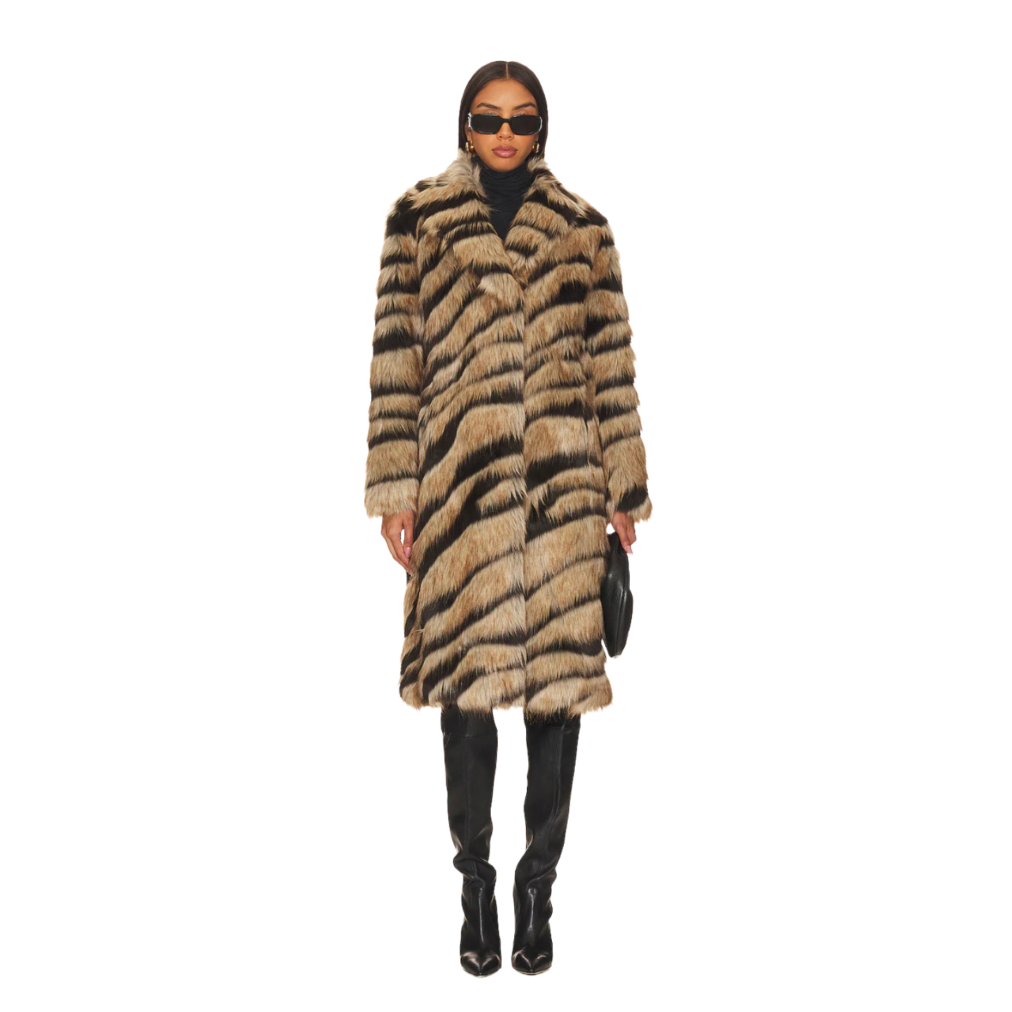 A model wearing a tiger print fur coat, black boots, and black sunglasses.