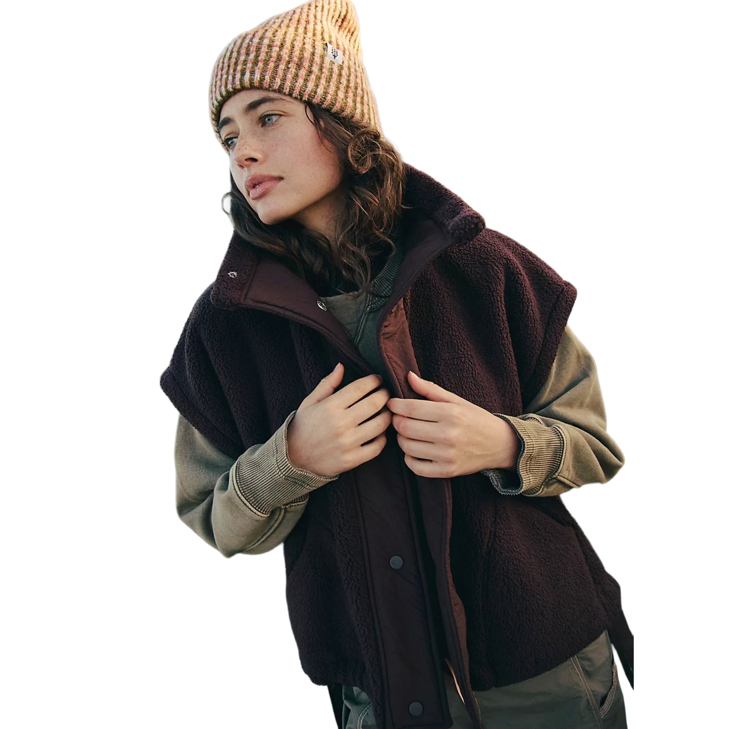 A model wearing a brown fleece vest.