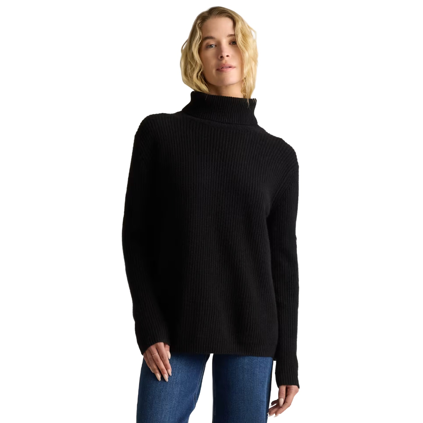 A model in a black cashmere turtleneck.