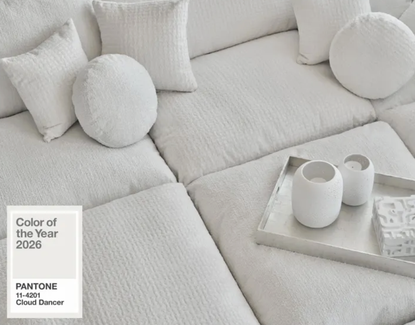 A cozy sofa in a white hue.
