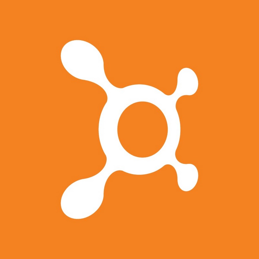 A white circular logo with an orange background. 