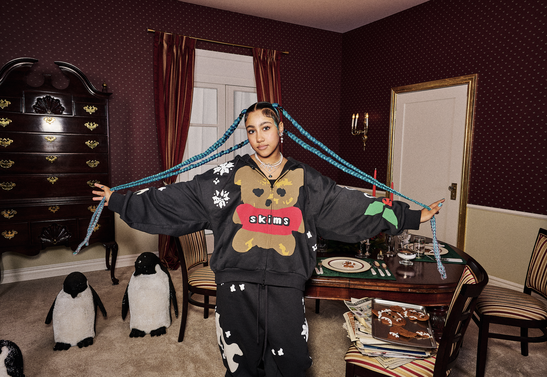 Kim Kardashian and North West pose at a Los Angeles Lakers basketball game.