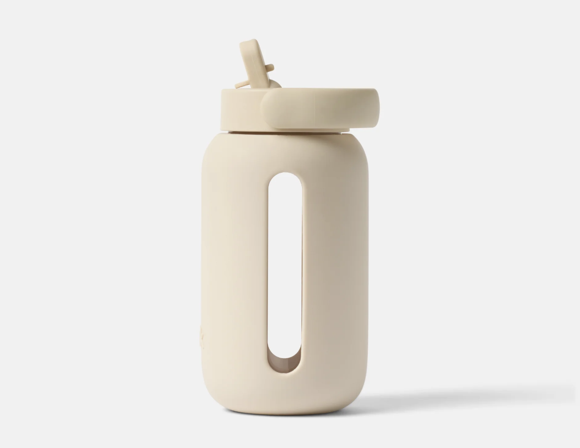 Glass water bottle with nude gripping.