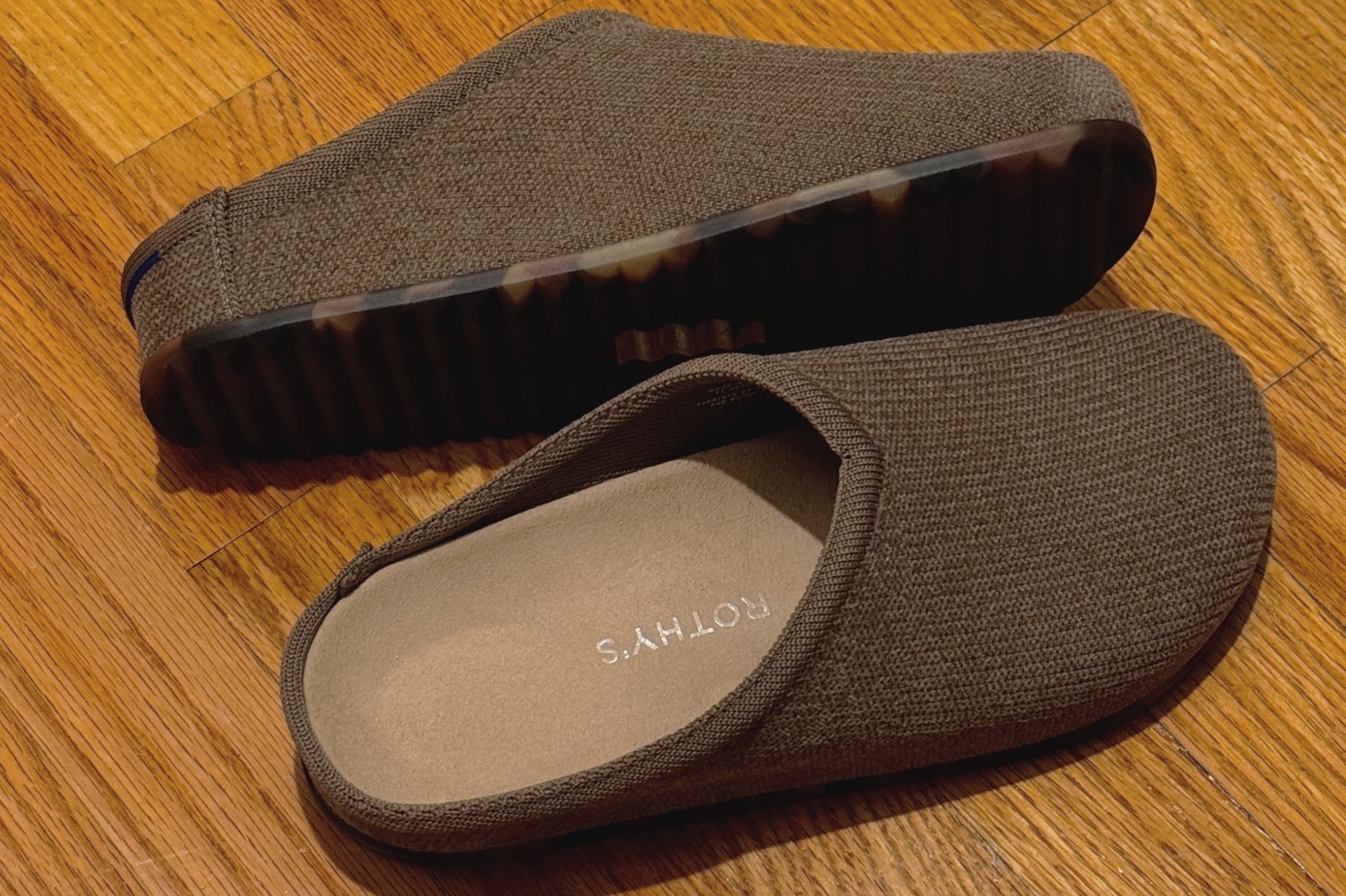 Two brown knit clog shoes. 