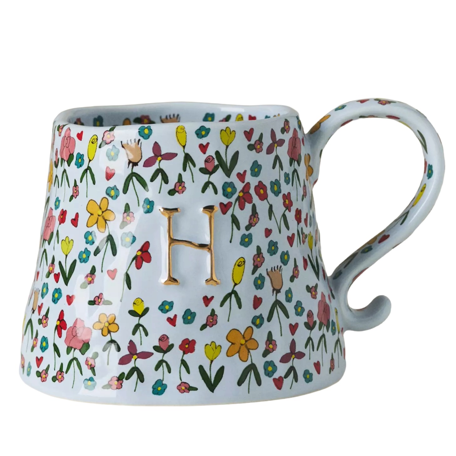 A floral mug with a the letter 