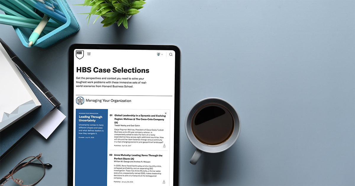 Tablet displaying HBS Case Selections beside a cup of coffee on a desk