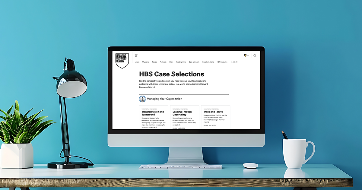 Desktop computer displaying Harvard Business Review case studies on a modern desk.