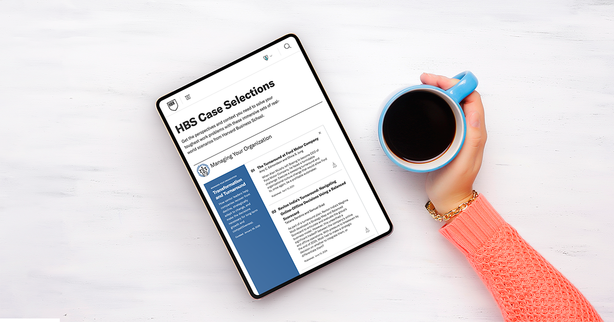 Tablet showing HBS Case Selections next to a hand holding a coffee mug