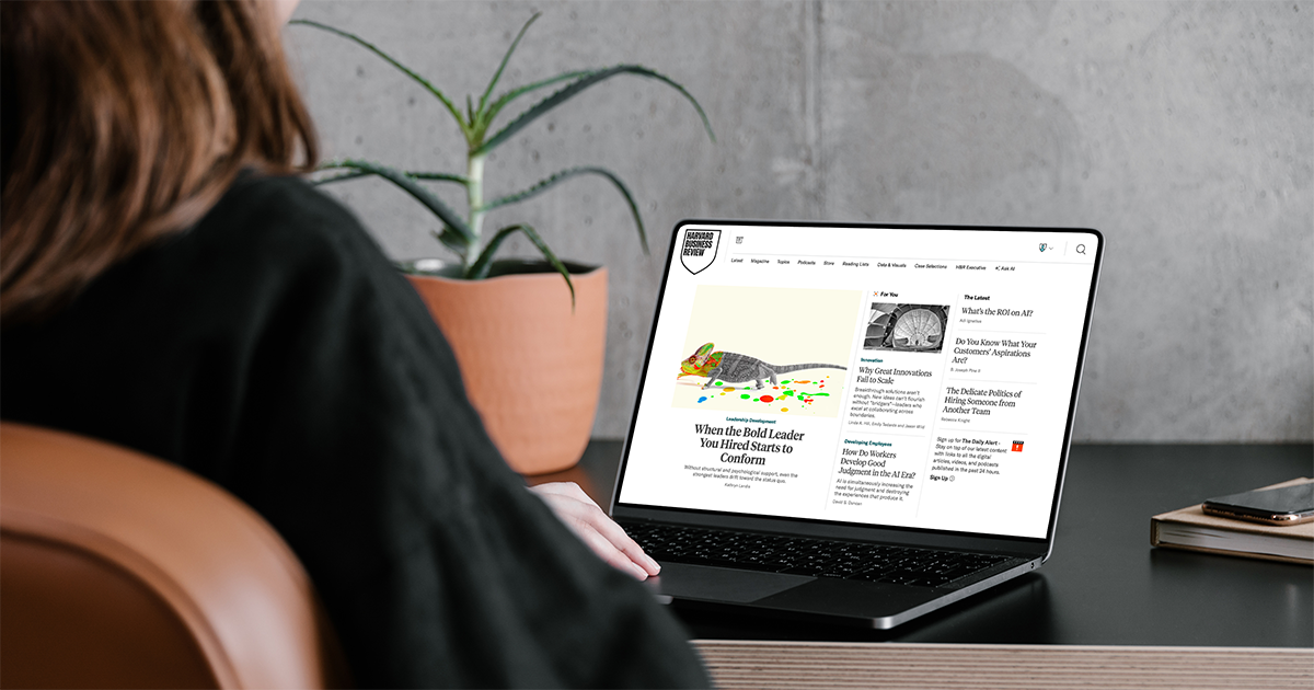 Person viewing the Harvard Business Review website on a laptop at a desk.