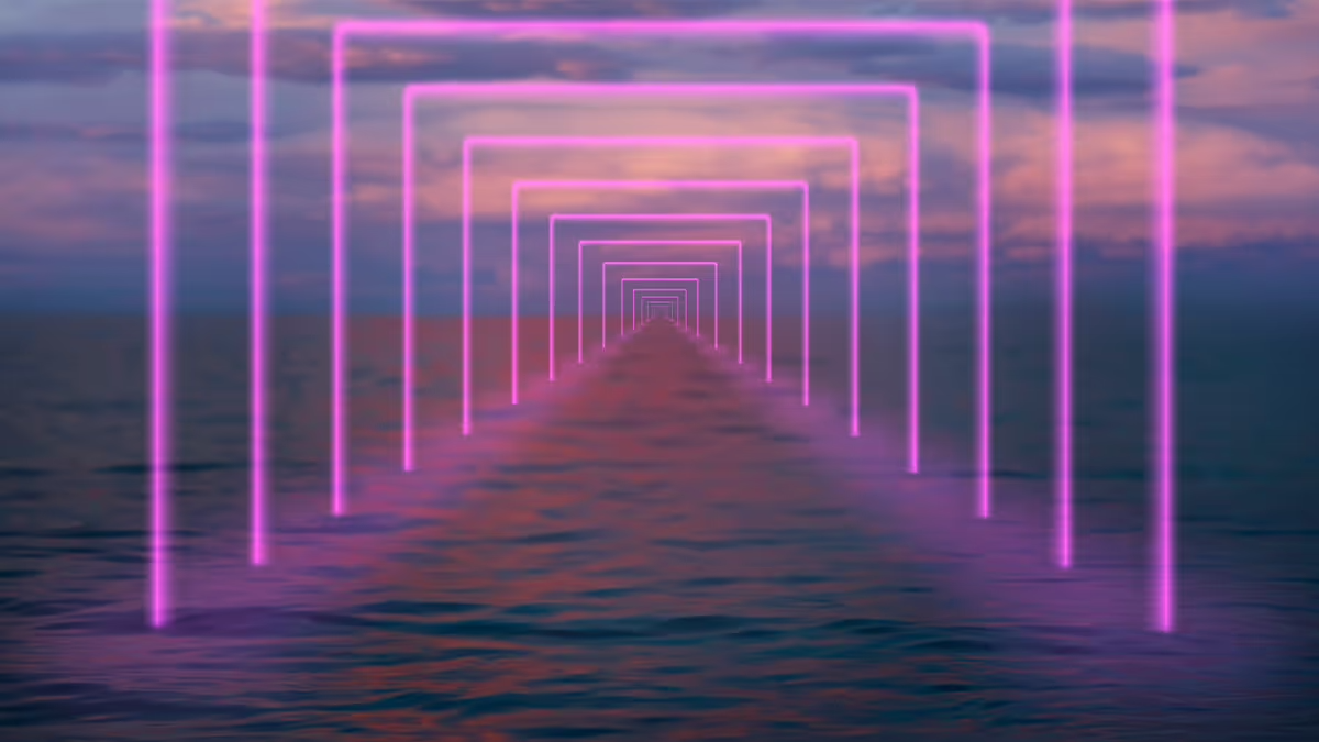 Neon pink rectangular frames receding into the distance over a calm ocean.