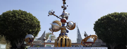 Visitors walk past Tomorrowland at Disneyland. 