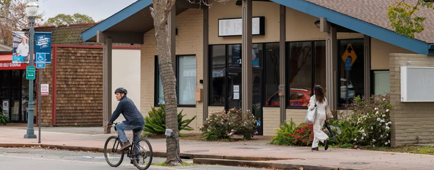 A man bikes down a street in Novato, Calif. A man bikes down a street in Novato, Calif.