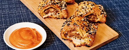 A wood board of sausage rolls - an Australian specialty 