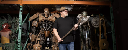 Dan Lanigan holds one of the props in his studio, Cinema Relic Archives