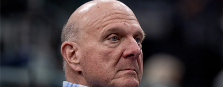Steve Ballmer wearing a blue plaid button-down shirt