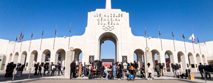 The cauldron is lit at the Coliseum during a 2025 Olympic news conference. 