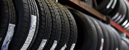 New tires are displayed on a rack at Robert's Tire and Wheels in San Francisco. 
