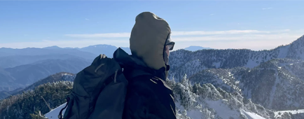A person on a snow-covered mountain. A person on a snow-covered mountain.
