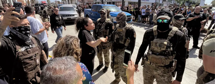 Residents confront ICE agents
