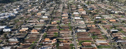 An aerial view of fire damaged properties in Pacific Palisades
