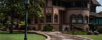 A pathway leads to the Doheny Mansion.
