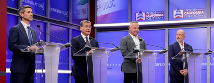 People stand at lecterns.