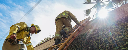 LA County Firefighters deal with a 12 ft. wall while mopping up a fire scene along the 210 freeway in Claremont. LA County Firefighters deal with a 12 ft. wall while mopping up a fire scene along the 210 freeway in Claremont.