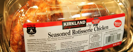 A packaged Kirkland rotisserie chicken on display