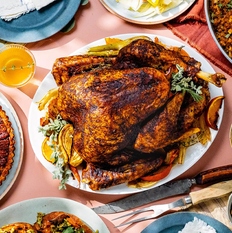 EL SEGUNDO, CA - OCTOBER 14 2025: A Thanksgiving spiced-rub turkey, mole, picadillo stuffing and chocolate pecan pie. 