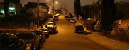 A dark street with crime scene tape.