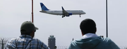A plane lands at LAX in September. A plane lands at LAX in September.