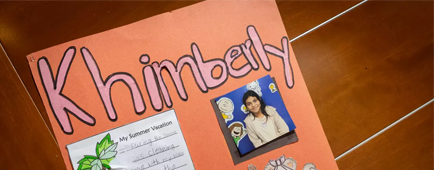 A poster lies on a conference table.