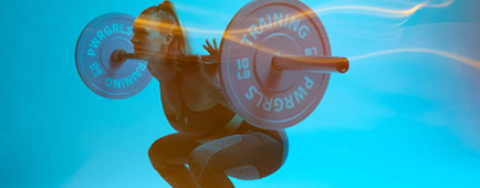 Kim Abt of Pwrgrls shows off her strength. Kim Abt of Pwrgrls shows off her strength.