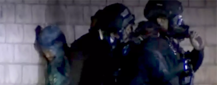 Police take a suspect into custody 