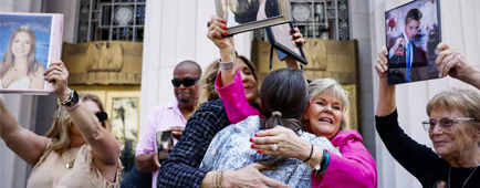 Relatives of victims walk out of the Los Angeles Superior Court