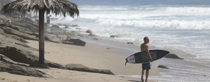 A surfer looks out at the ocean from Thalia Street Beach on Aug. 26 in Laguna Beach.