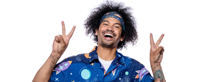 Mychal Threets uses his hands to hold up two peace signs while wearing a headband and a shirt with a space pattern