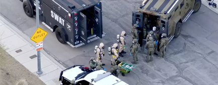 Las Vegas Metro Police and hazmat crews outside a Las Vegas-area residence.