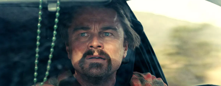 Leonardo DiCaprio drives a car in "One Battle After Another." 