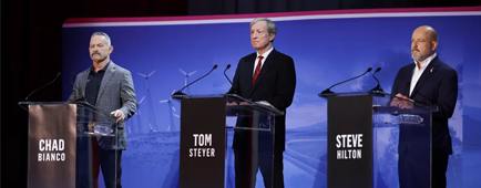 Chad Bianco, left, Tom Steyer and Steve Hilton stand behind podiums and speak into microphones.